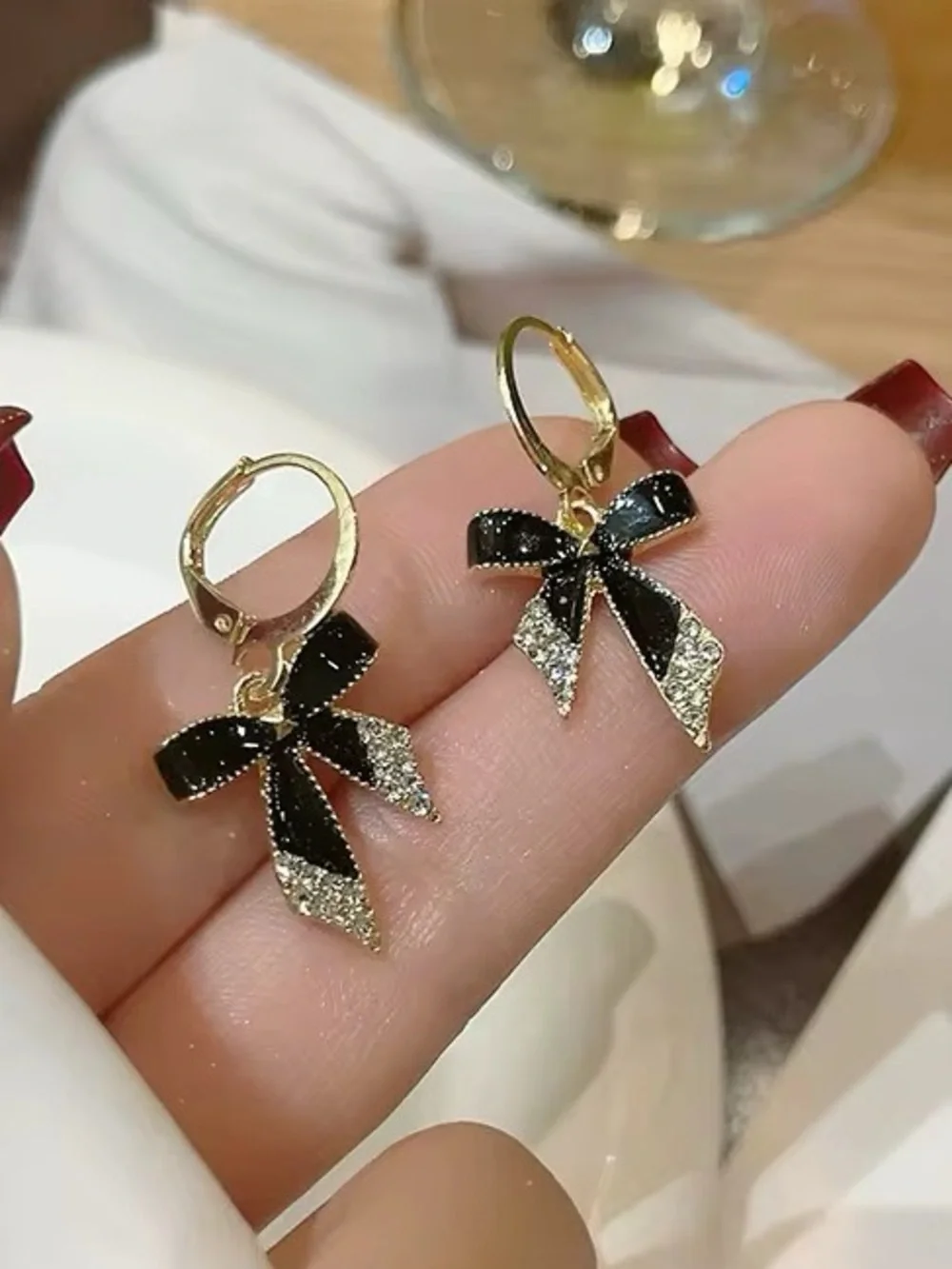 *** Delicate Gold Bow Drop Earrings with Black Enamel and Crystal Accents